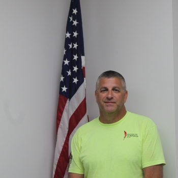 Johnny Cassidy next to flag